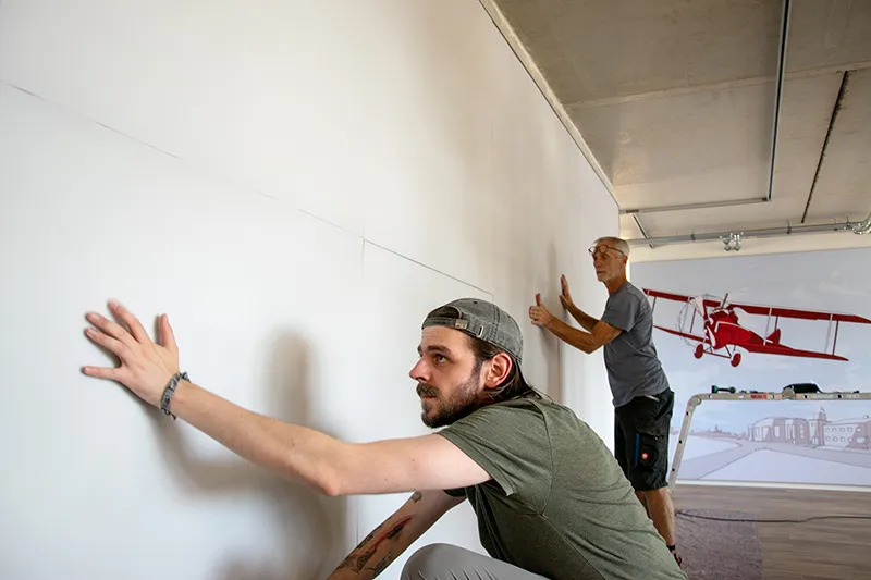willi jeschar acoustic wall installation - Andre Jeschar and Tim Krikava at work